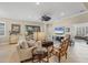 Bright living room with comfortable furniture and view to backyard at 21208 Sandal Foot Dr, Venice, FL 34293