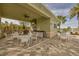 Covered outdoor kitchen and dining area near the pool at 21208 Sandal Foot Dr, Venice, FL 34293