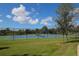 Well-maintained tennis court with surrounding green space at 21208 Sandal Foot Dr, Venice, FL 34293