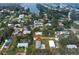 Aerial view of a neighborhood near a river and lush greenery, highlighting the home's location at 215 Portia N St, Nokomis, FL 34275