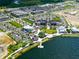 Aerial view showing a vibrant community, featuring lakefront scenery and various amenities at 215 Portia N St, Nokomis, FL 34275