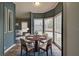 Dining area with table set and chair, with bright natural light from a bay window at 215 Portia N St, Nokomis, FL 34275
