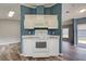 Kitchen area features modern appliances, ample cabinetry, laminate countertops, tile backsplash, and wood-look flooring at 215 Portia N St, Nokomis, FL 34275