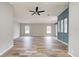 Inviting living room featuring stylish wood-look floors, neutral tones, and plenty of natural light at 215 Portia N St, Nokomis, FL 34275