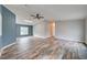 Spacious living room showcasing new flooring, neutral walls, and ample natural light at 215 Portia N St, Nokomis, FL 34275