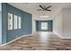 Modern living room with attractive floors, neutral walls, and an open-concept design at 215 Portia N St, Nokomis, FL 34275