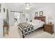 Main bedroom with a wooden bed frame and a barn door leading to the bathroom at 4160 Fruitville Rd # 14, Sarasota, FL 34232