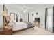 Main bedroom with a wooden bed frame and plenty of natural light at 4160 Fruitville Rd # 14, Sarasota, FL 34232