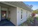 Gray building exterior with landscaping and walkway at 4160 Fruitville Rd # 14, Sarasota, FL 34232