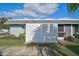 Well-maintained exterior with a landscaped yard and white fence at 4160 Fruitville Rd # 14, Sarasota, FL 34232