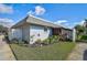 Well-maintained exterior with a landscaped yard and white fence at 4160 Fruitville Rd # 14, Sarasota, FL 34232