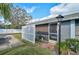 Well-maintained exterior with a landscaped yard and white fence at 4160 Fruitville Rd # 14, Sarasota, FL 34232
