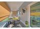 Relaxing screened porch with seating area and tropical plants at 4160 Fruitville Rd # 14, Sarasota, FL 34232