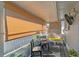 Relaxing screened porch with seating area and tropical plants at 4160 Fruitville Rd # 14, Sarasota, FL 34232
