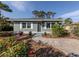 House exterior featuring a light blue facade and walkway at 828 Nokomis S Ave, Venice, FL 34285