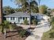 Charming bungalow with a landscaped yard and paved driveway at 828 Nokomis S Ave, Venice, FL 34285