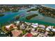 Aerial view of waterfront homes, lush landscaping, and beautiful canals leading to the Gulf of Mexico at 922 Casey Cove Dr, Nokomis, FL 34275