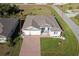 Single-Gathering home with a large front yard and driveway at 9401 President Cir, Port Charlotte, FL 33981