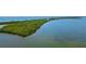 Aerial view of waterfront property with mangrove and access to the sea at 9401 President Cir, Port Charlotte, FL 33981