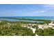 Aerial view of waterfront property with lush landscape and access to the sea at 9401 President Cir, Port Charlotte, FL 33981