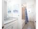 Bathroom with flamingo shower curtain and double vanity at 9401 President Cir, Port Charlotte, FL 33981