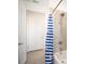 Bathroom with flamingo shower curtain and tub at 9401 President Cir, Port Charlotte, FL 33981
