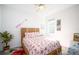 Bedroom with starfish bedding and wicker headboard at 9401 President Cir, Port Charlotte, FL 33981