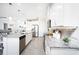 Modern kitchen with white cabinets, granite countertops and stainless steel appliances at 9401 President Cir, Port Charlotte, FL 33981