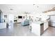 Modern kitchen with white cabinets, granite counters, and island at 9401 President Cir, Port Charlotte, FL 33981