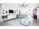Open concept living space with light-colored furniture and kitchen views at 9401 President Cir, Port Charlotte, FL 33981