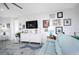 Light and airy living room with a comfortable sofa and large TV at 9401 President Cir, Port Charlotte, FL 33981