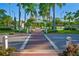 Attractive pedestrian walkway through a landscaped area at 9401 President Cir, Port Charlotte, FL 33981