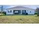 House with screened lanai and spacious backyard at 9401 President Cir, Port Charlotte, FL 33981