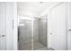 Large walk-in shower with gray tile and glass enclosure at 9401 President Cir, Port Charlotte, FL 33981