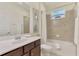 Clean bathroom with tub and shower at 9847 Haze Dr, Venice, FL 34292
