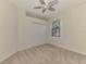 Simple bedroom with carpet and ceiling fan at 9847 Haze Dr, Venice, FL 34292