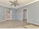 Spacious bedroom with tile floors and ceiling fan at 9847 Haze Dr, Venice, FL 34292