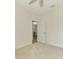 Spacious bedroom with carpet flooring and access to the dining room at 9847 Haze Dr, Venice, FL 34292