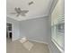 Bright bedroom with ceiling fan and tile floors at 9847 Haze Dr, Venice, FL 34292