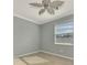 Bright bedroom with ceiling fan and tile floors at 9847 Haze Dr, Venice, FL 34292