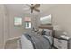 Bright bedroom with a queen bed and ceiling fan at 9847 Haze Dr, Venice, FL 34292