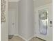 View of entryway with interior door and access to another room at 9847 Haze Dr, Venice, FL 34292