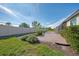 Home exterior with a well-maintained lawn and brick patio at 9847 Haze Dr, Venice, FL 34292