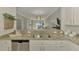 Modern kitchen with stainless steel appliances and granite countertops at 9847 Haze Dr, Venice, FL 34292