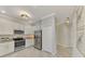 Modern kitchen with stainless steel appliances and granite countertops at 9847 Haze Dr, Venice, FL 34292