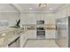 Modern kitchen with stainless steel appliances and granite countertops at 9847 Haze Dr, Venice, FL 34292