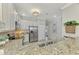 Modern kitchen with stainless steel appliances and granite countertops at 9847 Haze Dr, Venice, FL 34292