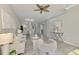 Open concept living room with view into dining room and kitchen at 9847 Haze Dr, Venice, FL 34292