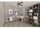 Home office with built-in shelving and desk at 9847 Haze Dr, Venice, FL 34292