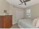 Serene bedroom with a dresser, double closet, and full bed at 9855 Haze Dr, Venice, FL 34292